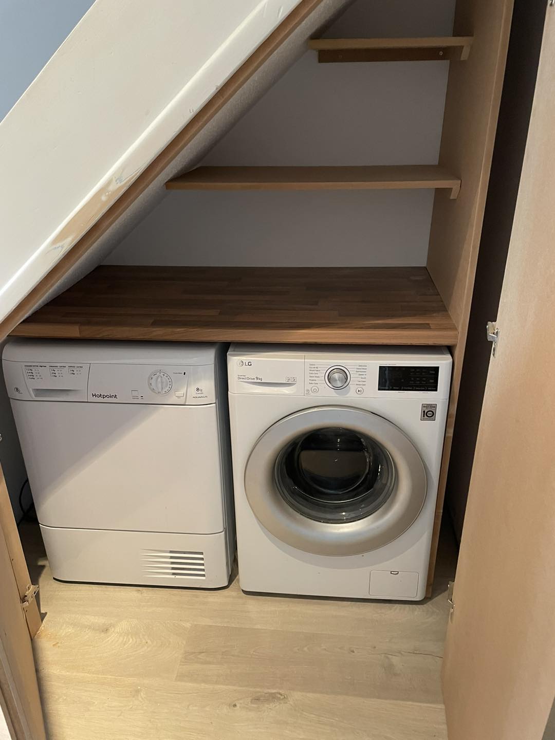 Tumble dryer and washing machine installed under stairs