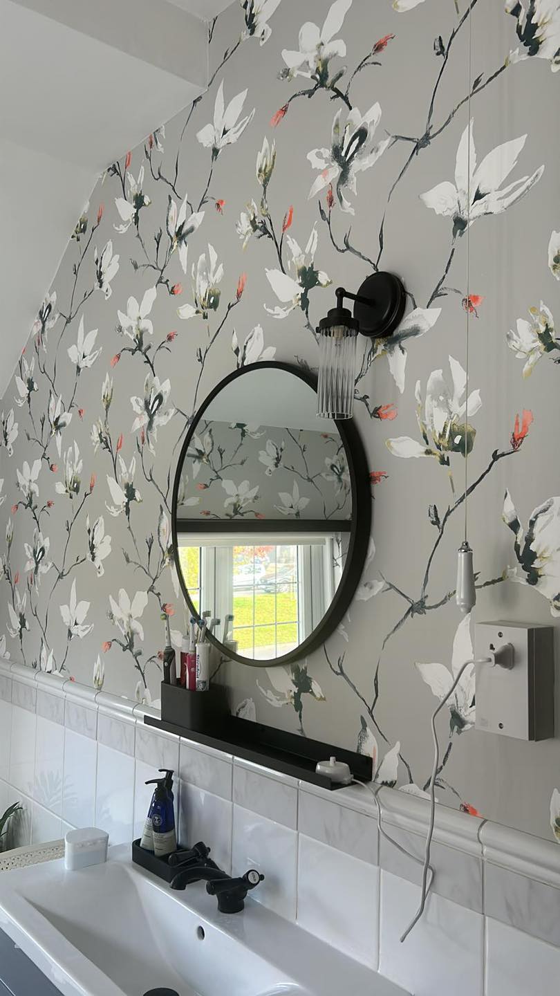 Flower pattern wall paper on bathroom wall