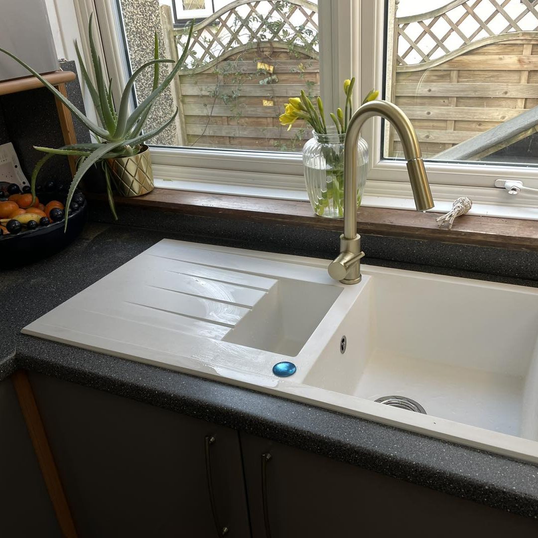 Gold tap with cream sink